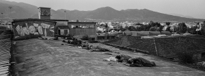 2 July 2017 – People, some of whom are minors, sleep on the top of an abandoned factory which is a temporary home for refugees in Patras, southwestern Greece.