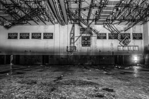 16 February 2019 – The gym at former basketball powerhouse Flint Central High School, in Flint, Michigan, USA, stands derelict, eight years after the school permanently closed. The American flag and the team banners, both covered in mold, can still be seen in the rafters.