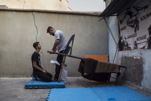 10 September 2020 – Saeed's brother helps him with rehabilitation exercises, Gachsaran, Iran.