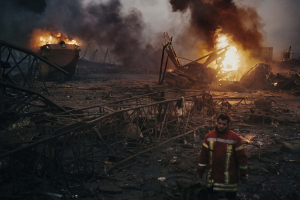 4 August 2020 – A firefighter stands in a devastated area of the port in Beirut, Lebanon, after working to put out the fires that engulfed the warehouses in the port after a massive explosion.