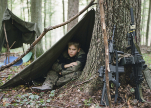 17 October 2020 – Robert rests in his newly built shelter during an activity at a weekend military club in Żuławka Forest in Gdańsk, Poland.
